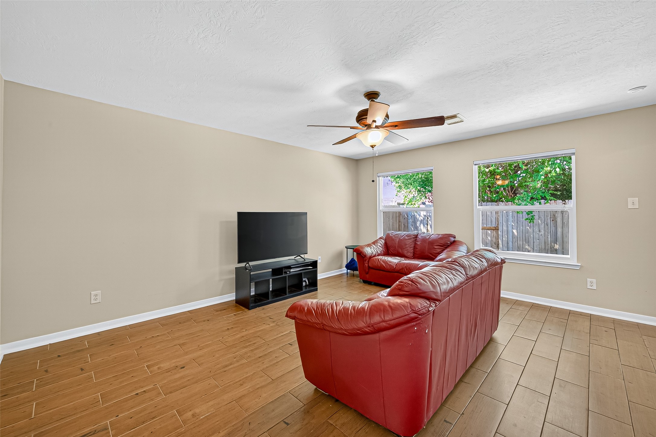 4630 Twisting Road Houston, TX 77084 - Photo 14 of 49 a living room with furniture and a flat screen tv