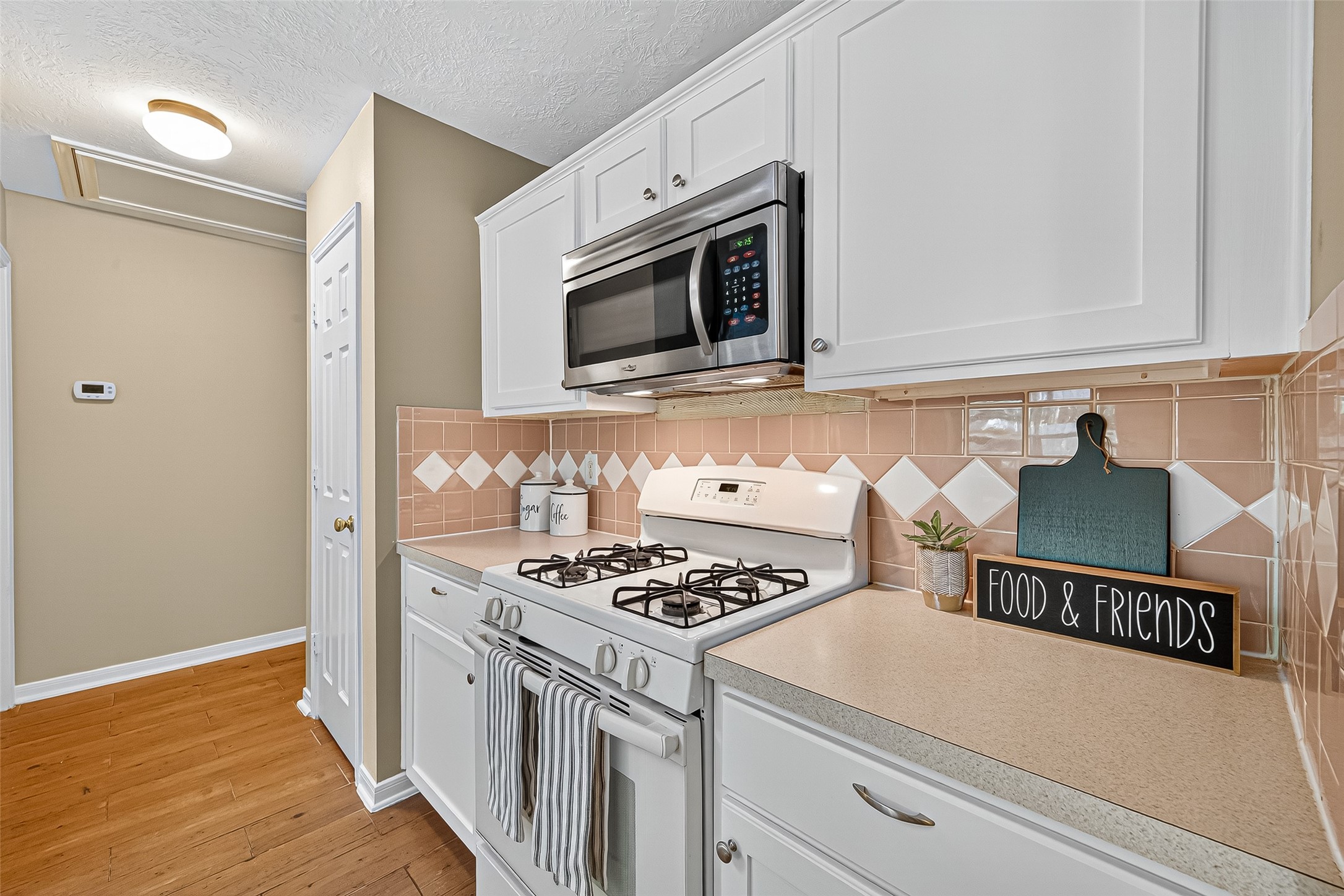 4630 Twisting Road Houston, TX 77084 - Photo 27 of 49 a kitchen with a stove and a microwave