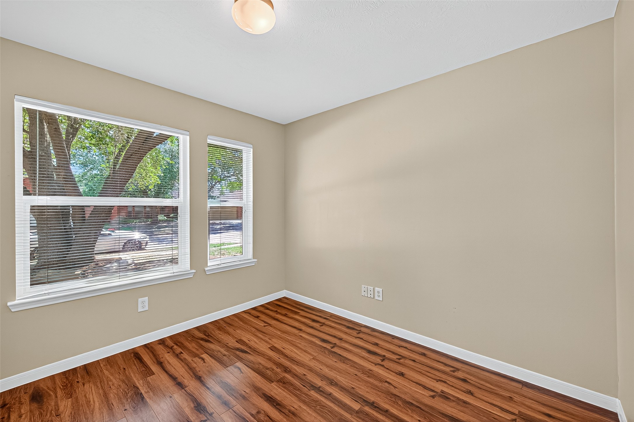 4630 Twisting Road Houston, TX 77084 - Photo 39 of 49 a view of an empty room with wooden floor and a window
