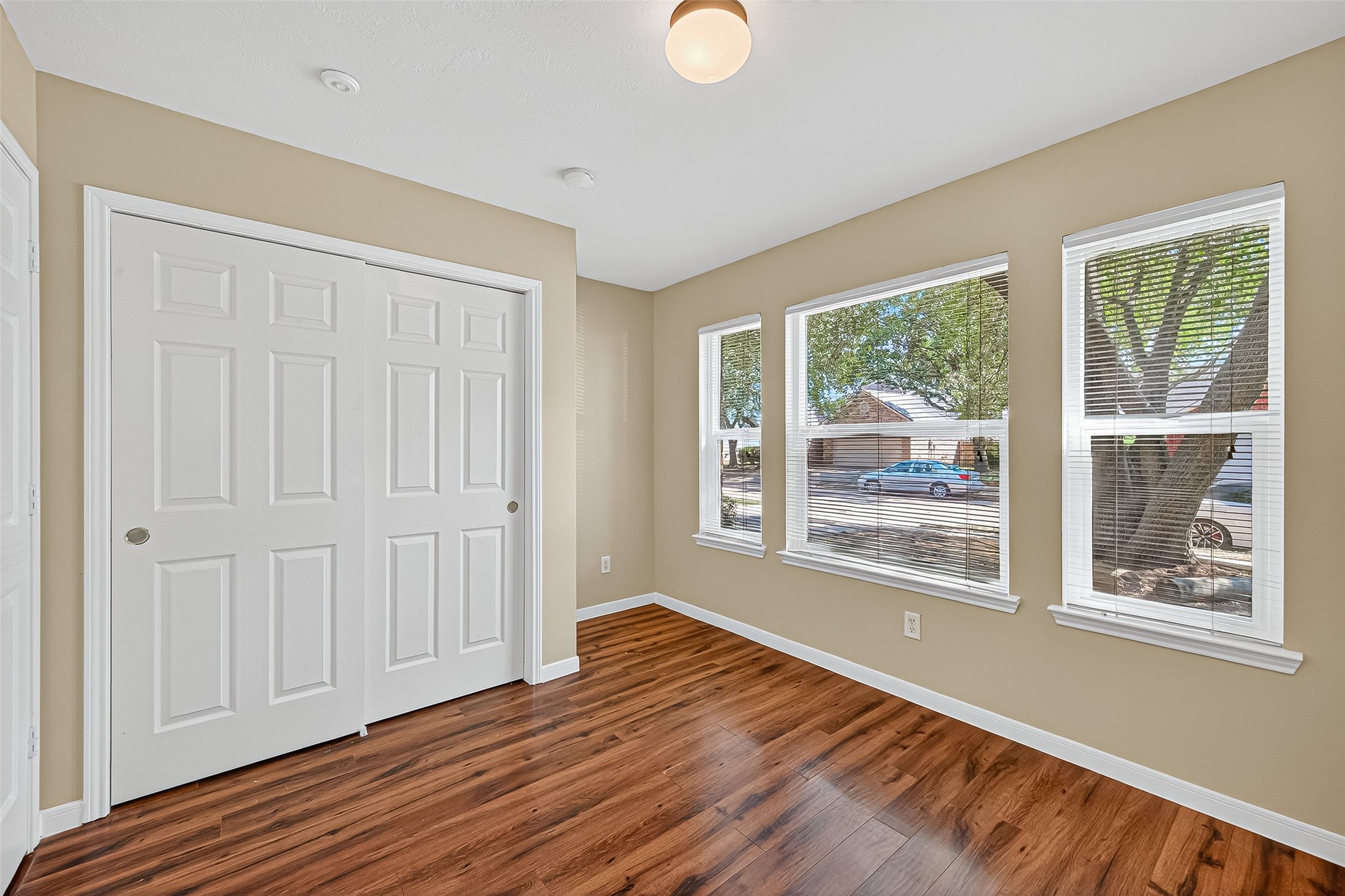 4630 Twisting Road Houston, TX 77084 - Photo 40 of 49 a view of an empty room with wooden floor and a window