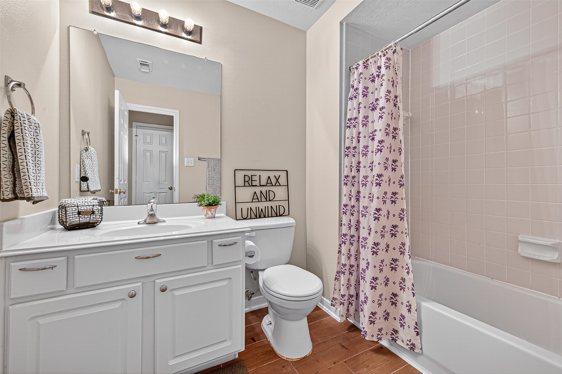 4630 Twisting Road Houston, TX 77084 - Photo 42 of 49 a bathroom with a double vanity sink toilet and shower