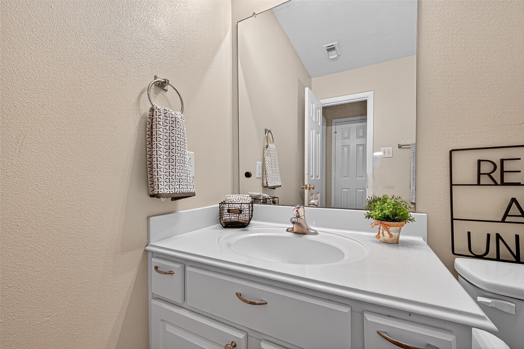 4630 Twisting Road Houston, TX 77084 - Photo 43 of 49 a bathroom with a sink and a mirror