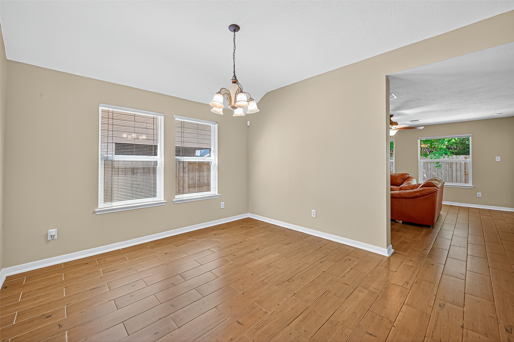 4630 Twisting Road Houston, TX 77084 - Photo 8 of 49 a view of livingroom with furniture wooden floor and a chandelier