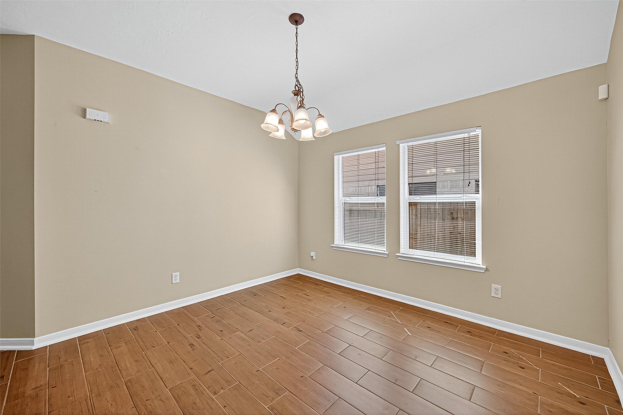 4630 Twisting Road Houston, TX 77084 - Photo 9 of 49 wooden floor in an empty room with a window