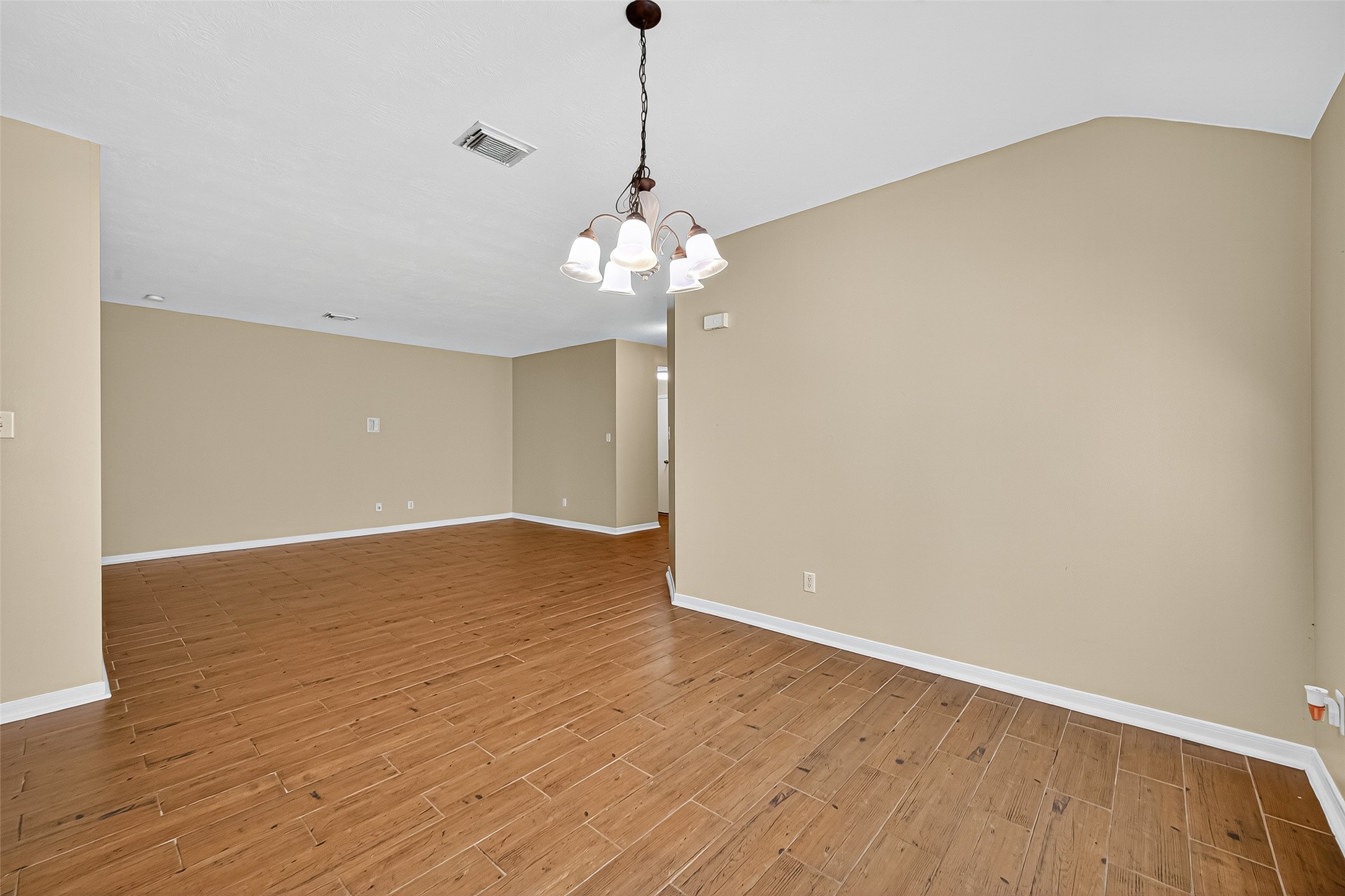 4630 Twisting Road Houston, TX 77084 - Photo 10 of 49 a view of wooden floor and chandelier in a room