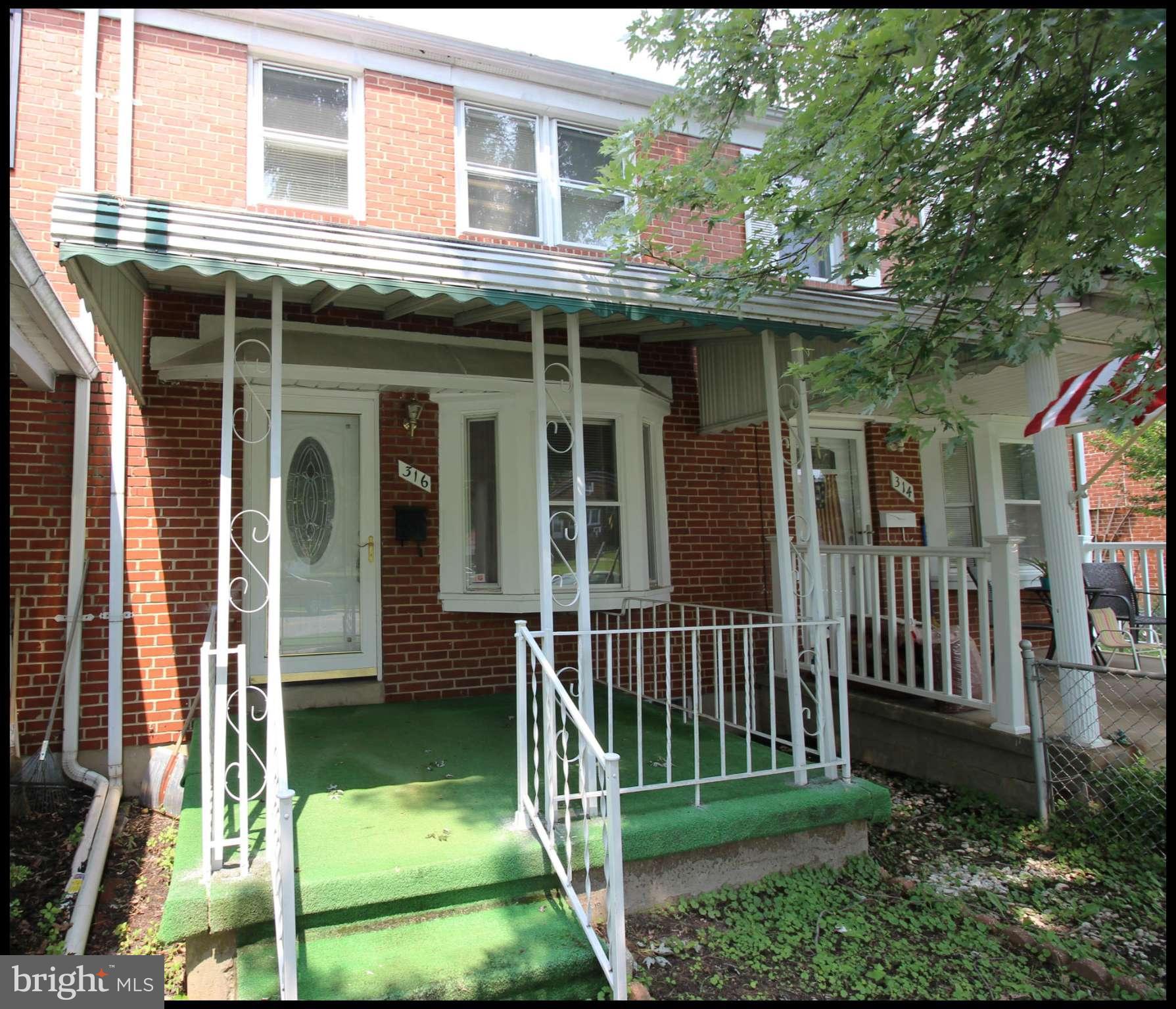 316 Stemmers Run Road Baltimore, MD 21221 - Photo 1 of 20 a view of a house with a yard and plants