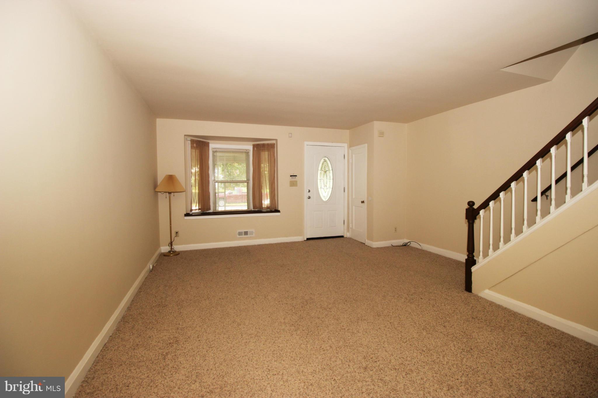 316 Stemmers Run Road Baltimore, MD 21221 - Photo 2 of 20 a view of an empty room with a window