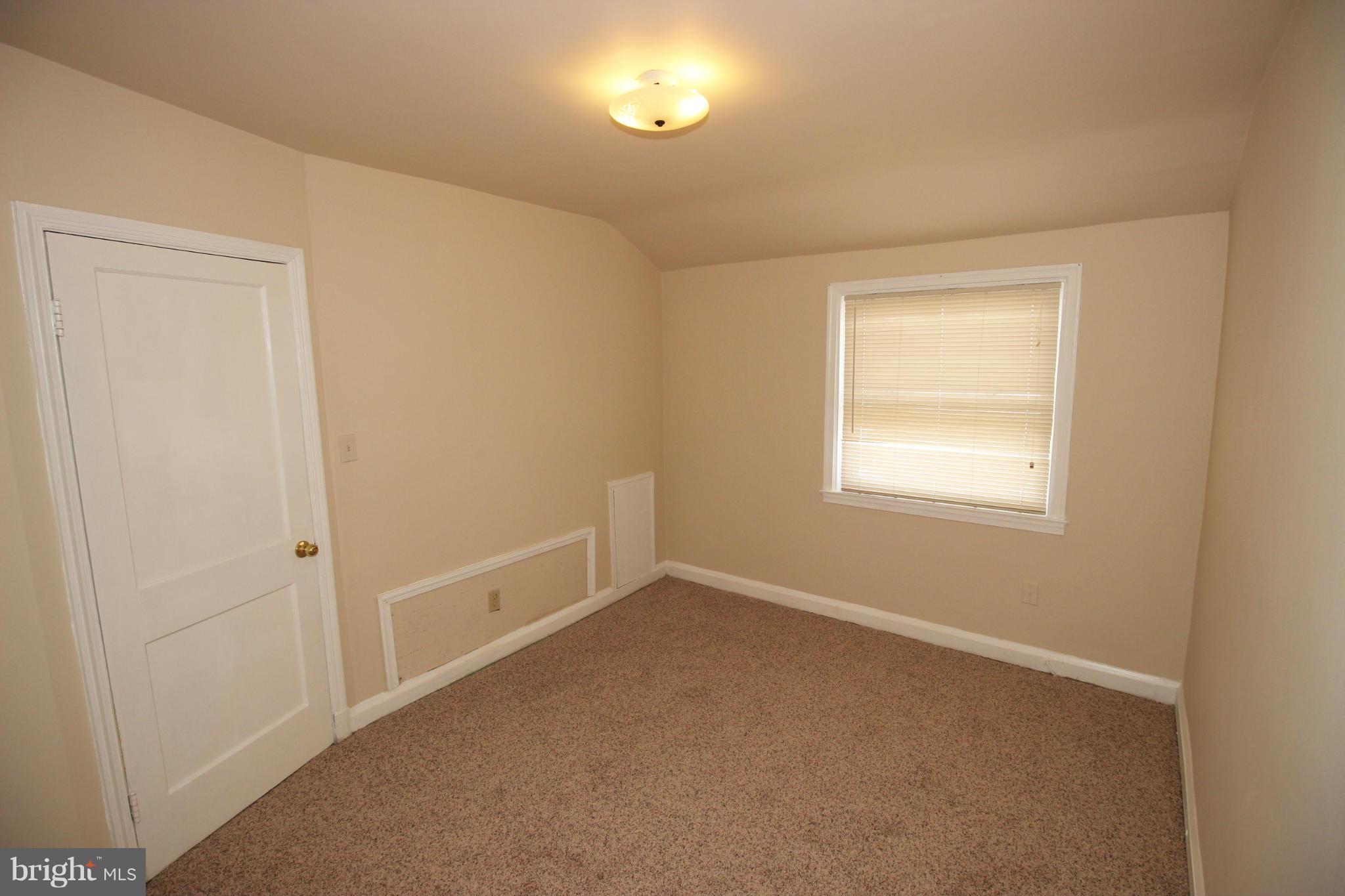 316 Stemmers Run Road Baltimore, MD 21221 - Photo 20 of 20 an empty room with a window