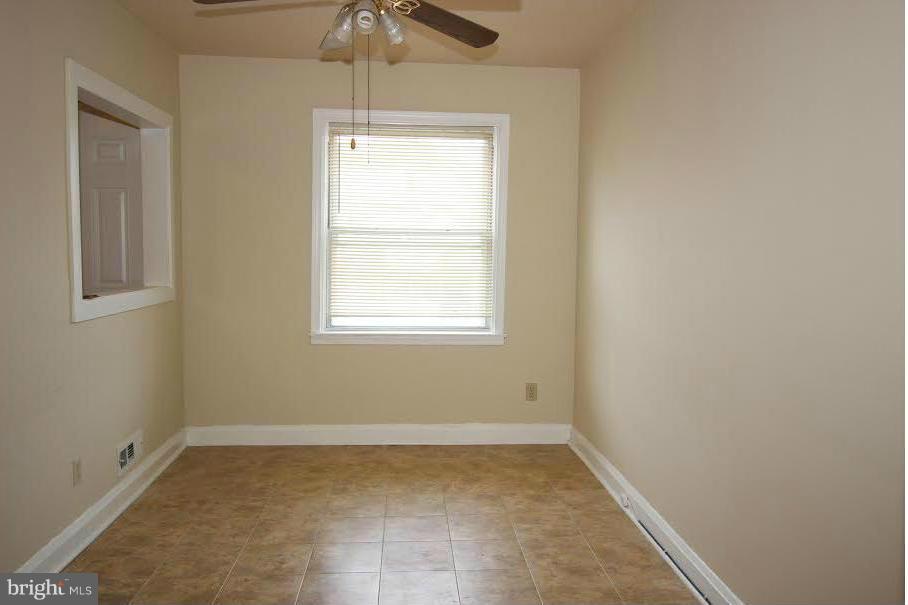 316 Stemmers Run Road Baltimore, MD 21221 - Photo 6 of 20 an empty room with a window