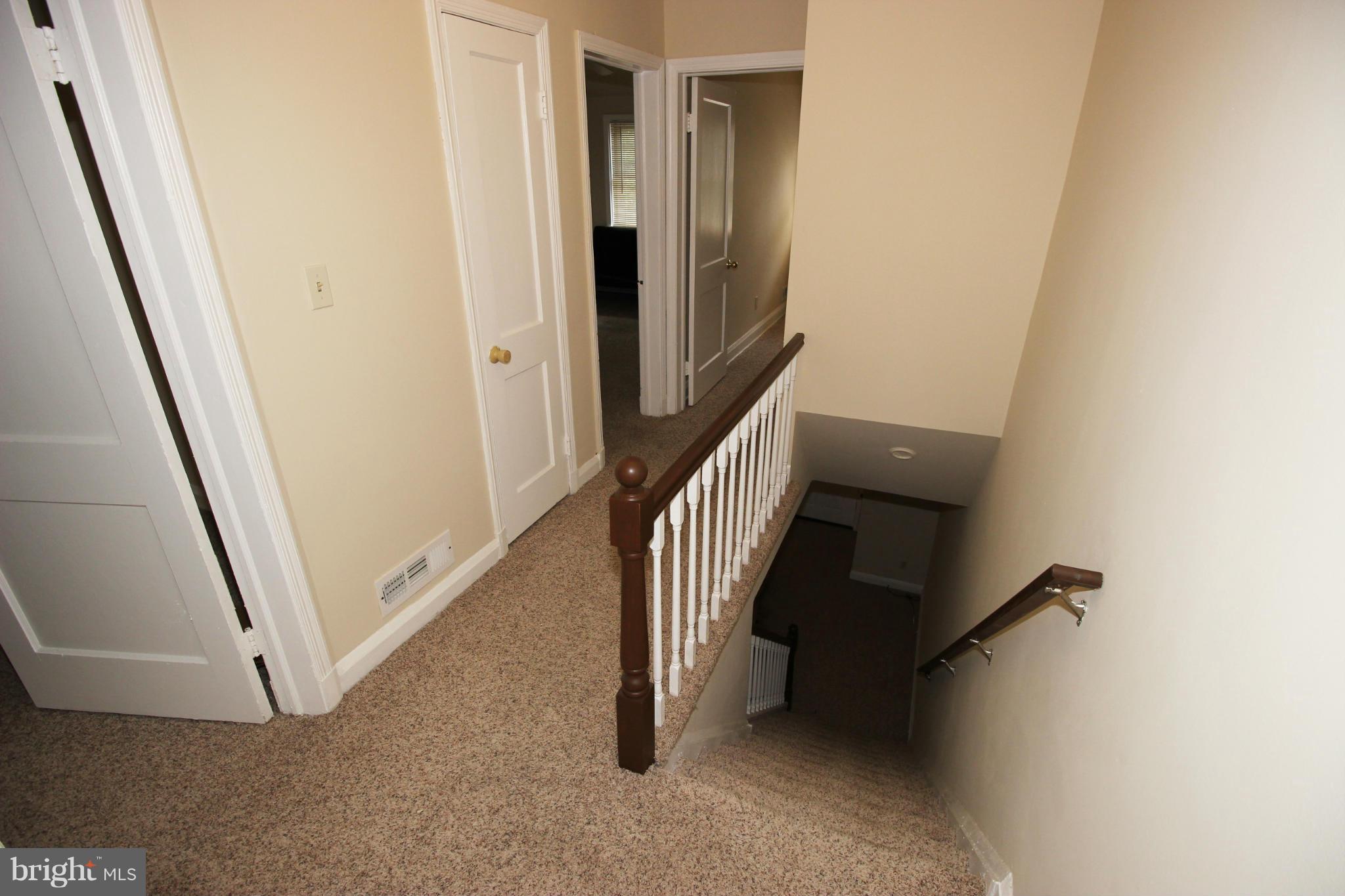 316 Stemmers Run Road Baltimore, MD 21221 - Photo 9 of 20 a view of a hallway with staircase