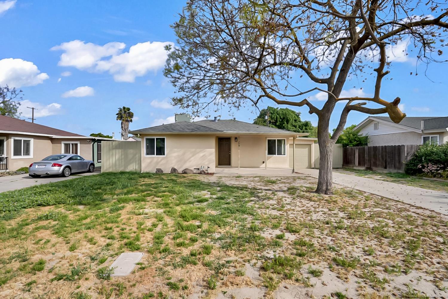209 Emerson Avenue Modesto, CA 95350 - Photo 1 of 1 a front view of a house with garden