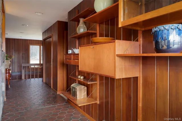 a view of a room with wooden walls