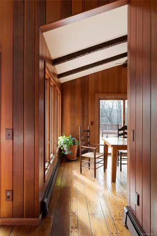 a dining room with a table and chairs
