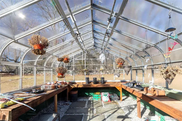 a view of a chairs and table in a patio