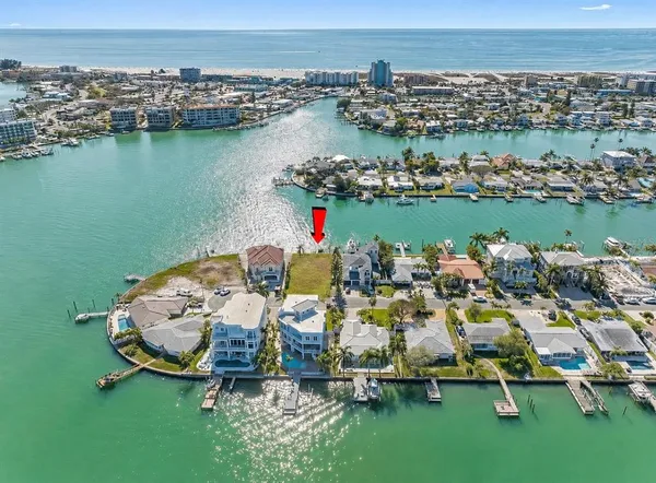 an aerial view of a house with a lake view