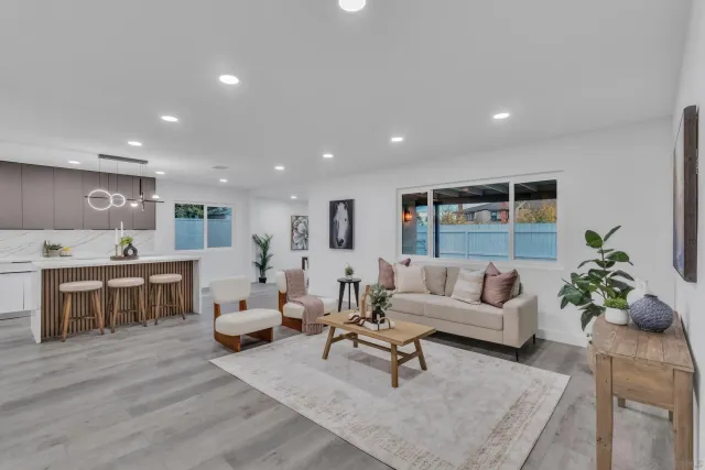 a living room with furniture and a table