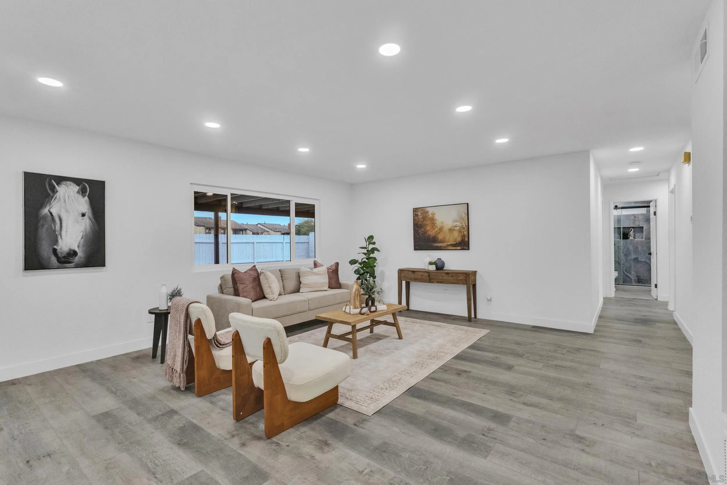 9253 Les Road Santee, CA 92071 - Photo 20 of 35 a living room with furniture and a wooden floor