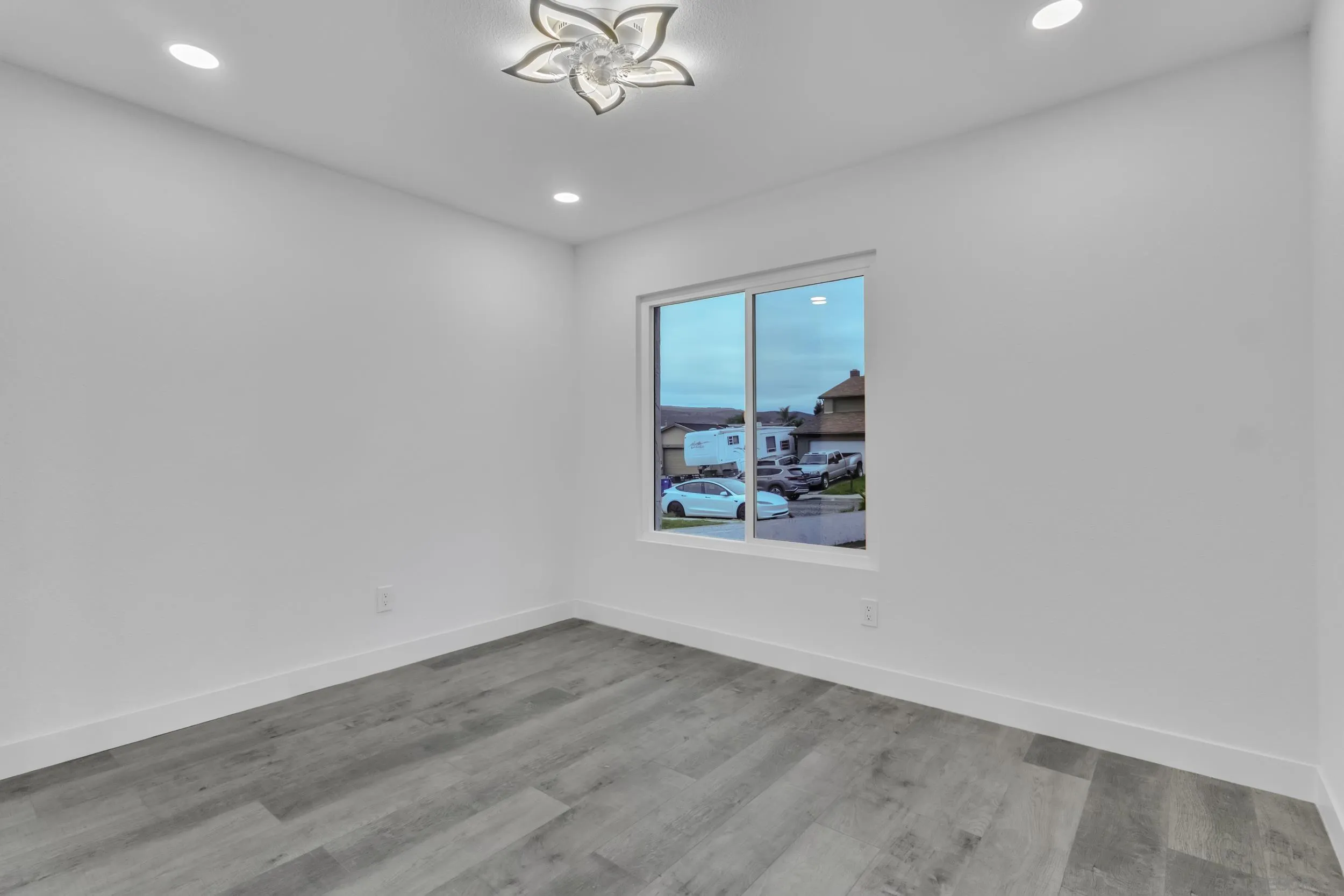 9253 Les Road Santee, CA 92071 - Photo 23 of 35 an empty room with windows and fan