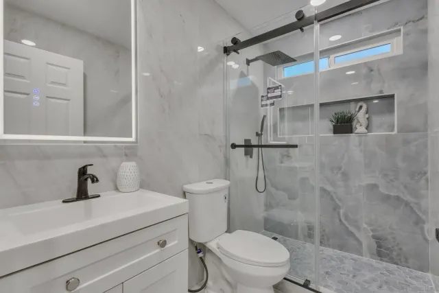 a bedroom with a bed and a lamp on table