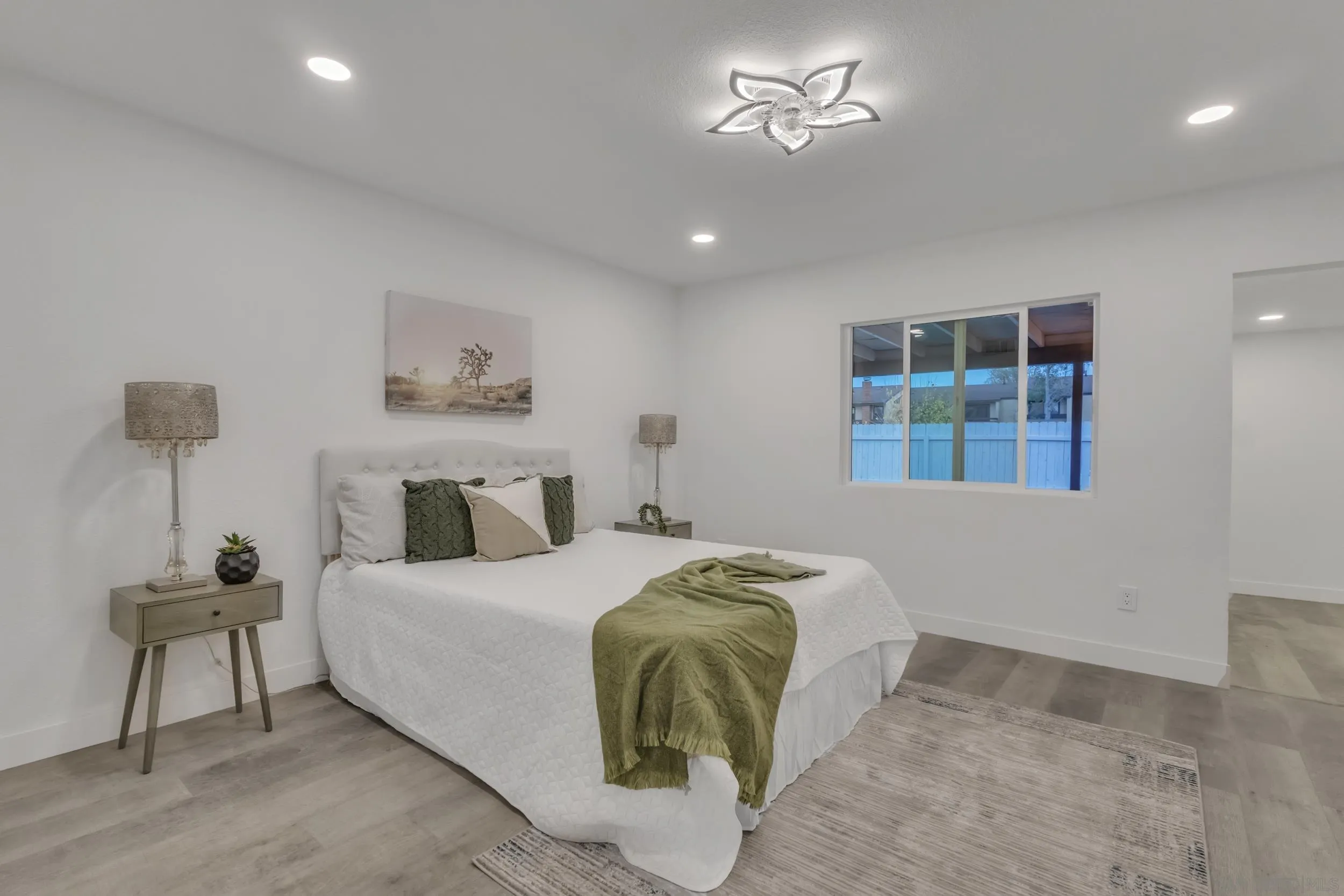 9253 Les Road Santee, CA 92071 - Photo 25 of 35 a bedroom with a bed and a lamp on table