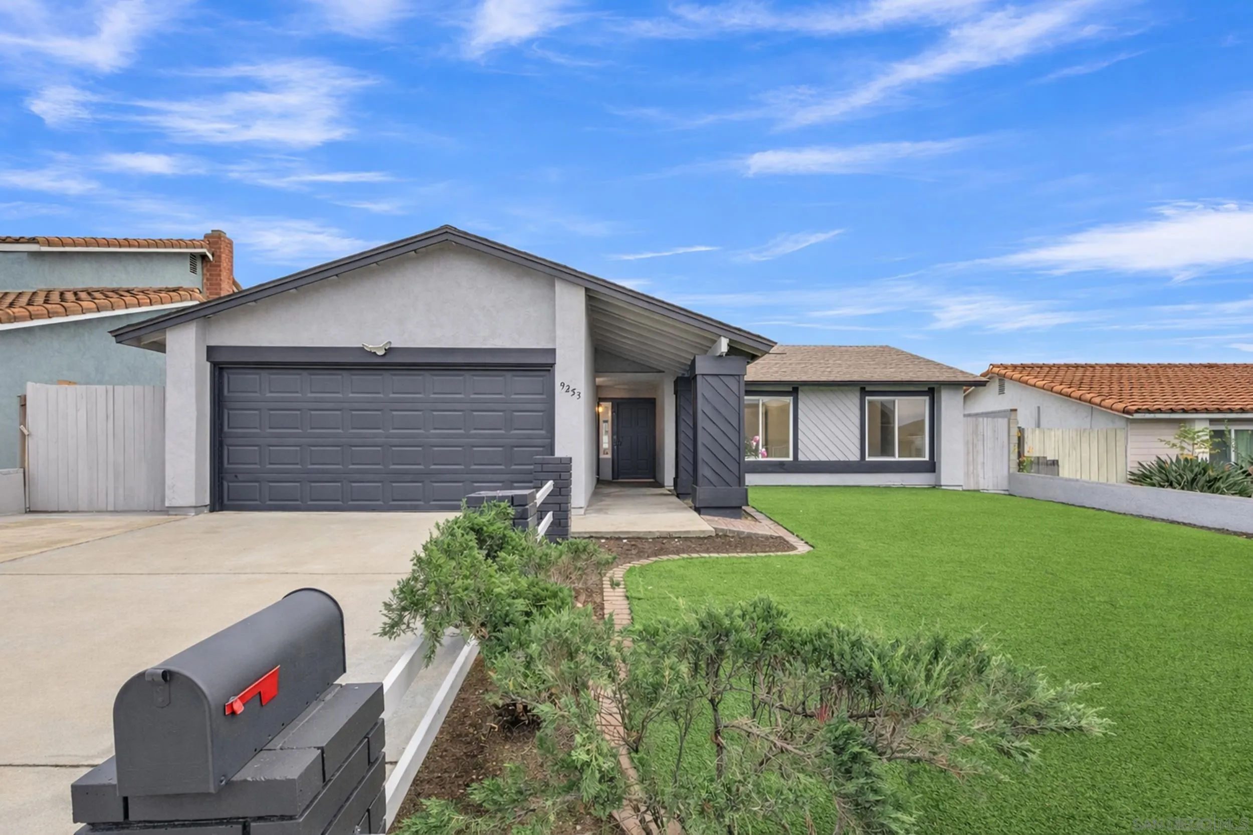 9253 Les Road Santee, CA 92071 - Photo 7 of 35 a front view of a house with garden