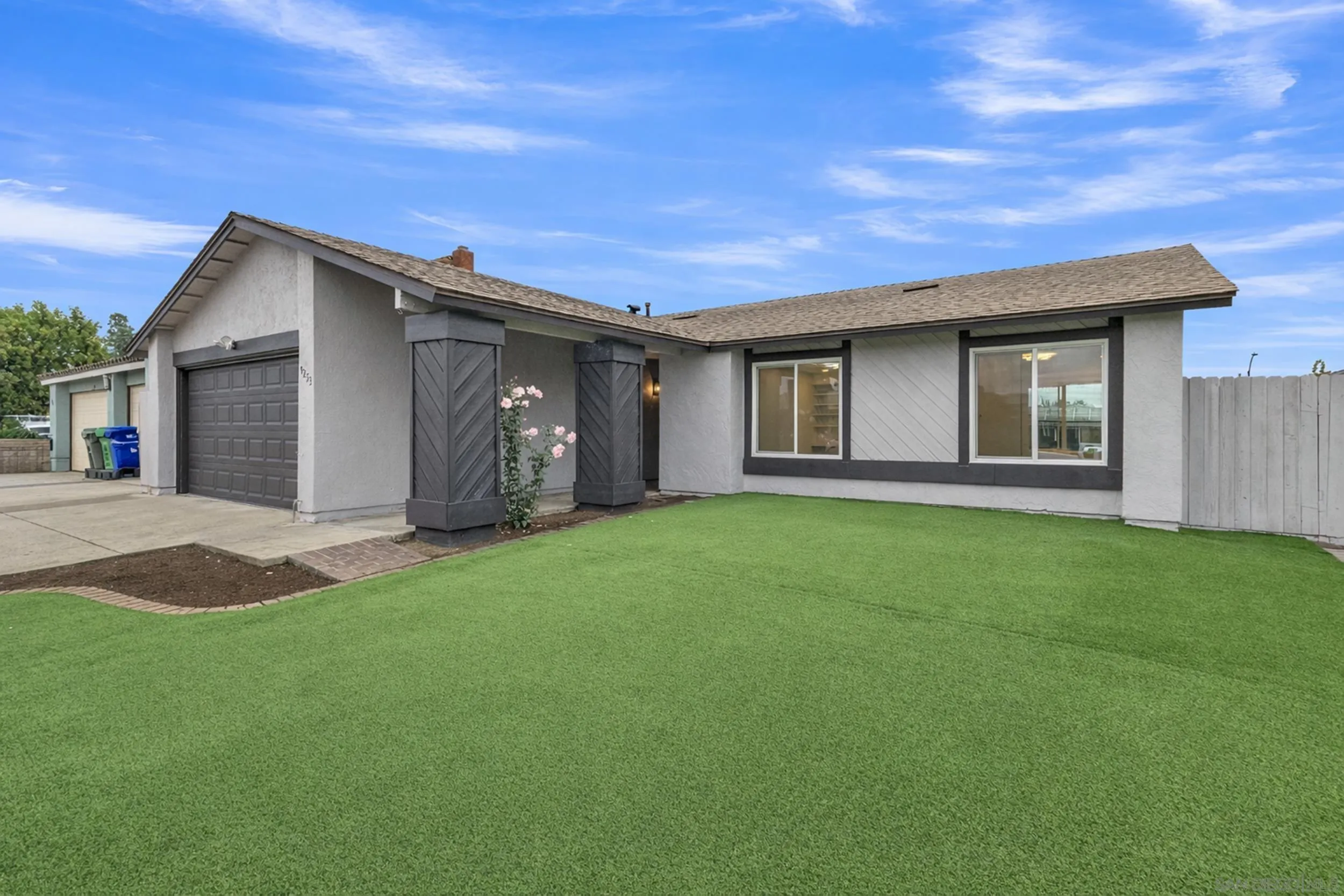 9253 Les Road Santee, CA 92071 - Photo 8 of 35 a front view of house with yard and green space
