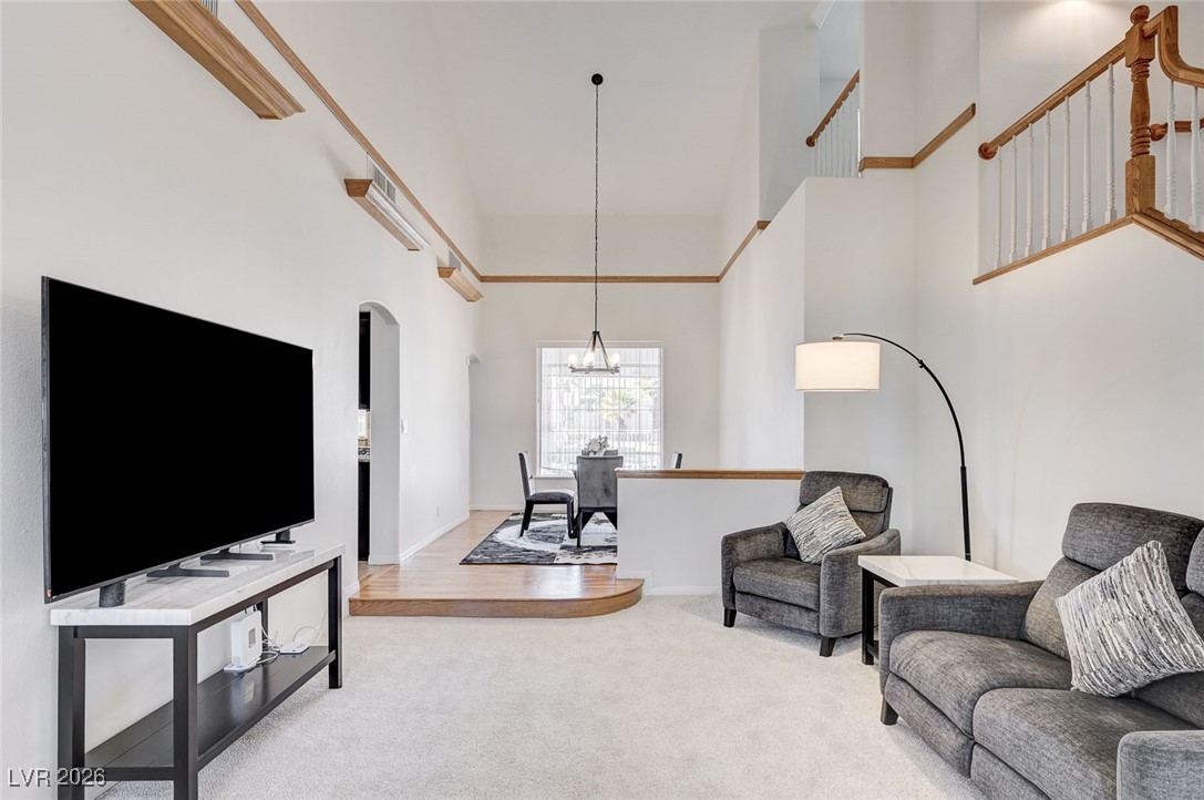 2955 El Camino Road Las Vegas, NV 89146 - Photo 38 of 99 Living room with a high ceiling and carpet floors
