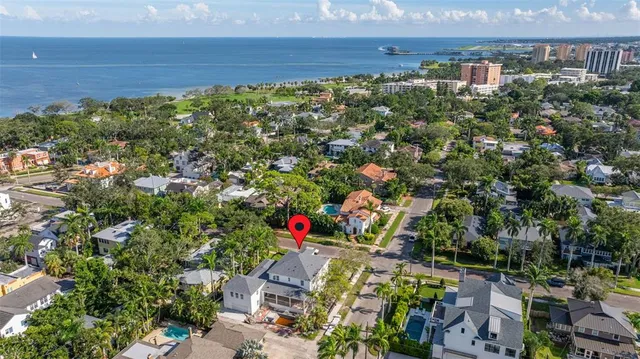 a view of a bunch of flowers in front of house