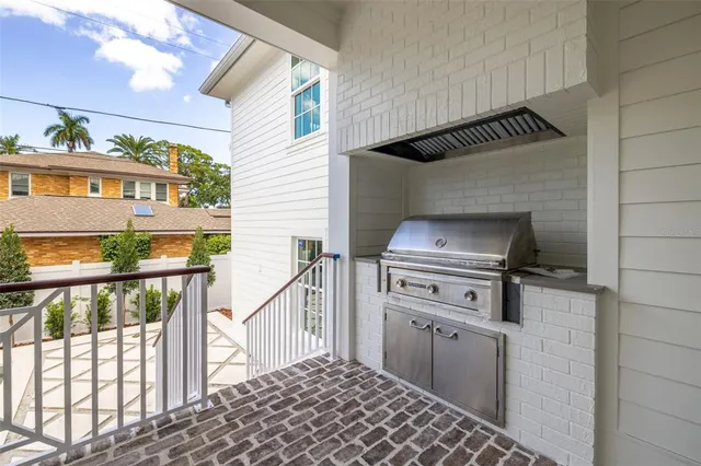 a kitchen that has a sink and a stove