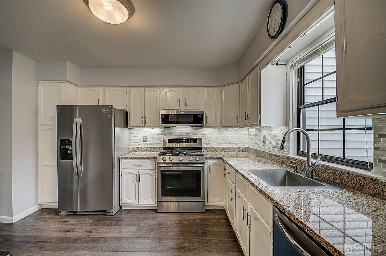 3102 Stonehedge Road Edison, NJ 08820 - Photo 14 of 41 a kitchen with a sink stove and refrigerator