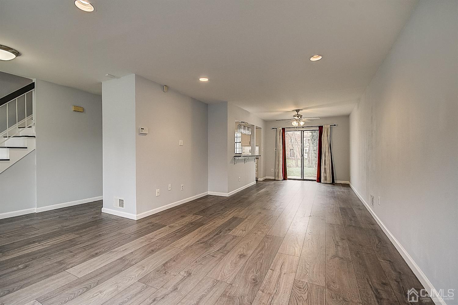 3102 Stonehedge Road Edison, NJ 08820 - Photo 8 of 41 a view of an empty room with wooden floor and closet