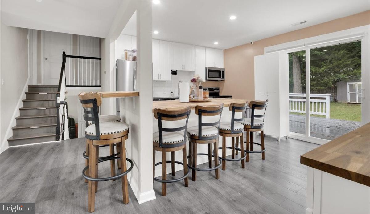 18907 Barnette Circle Triangle, VA 22172 - Photo 11 of 39 a view of a dining room with furniture and wooden floor