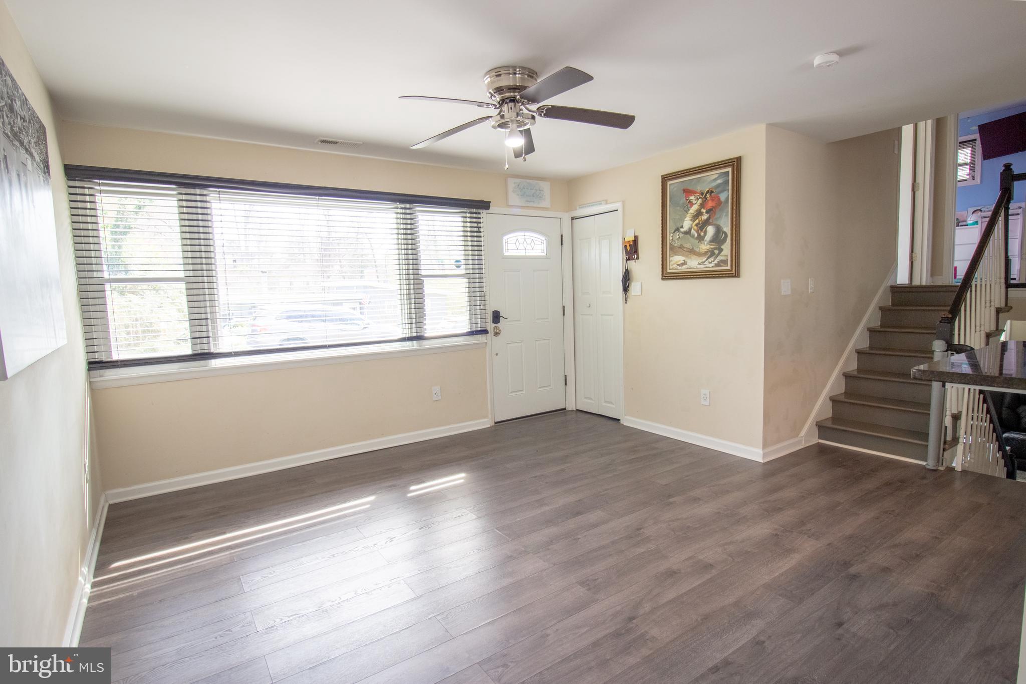 18907 Barnette Circle Triangle, VA 22172 - Photo 12 of 39 wooden floor in an empty room with a window