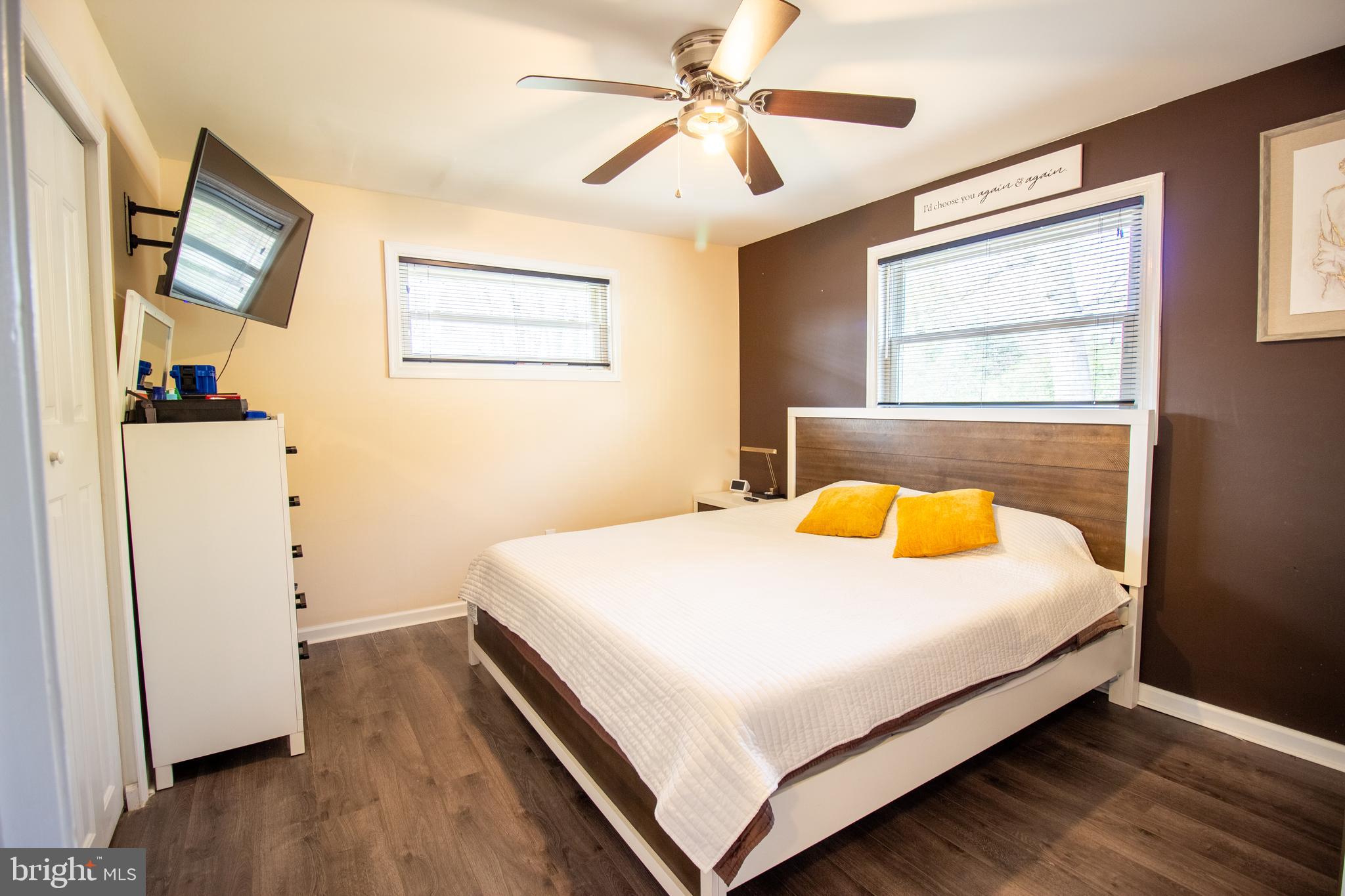 18907 Barnette Circle Triangle, VA 22172 - Photo 14 of 39 a bedroom with a bed and a chandelier