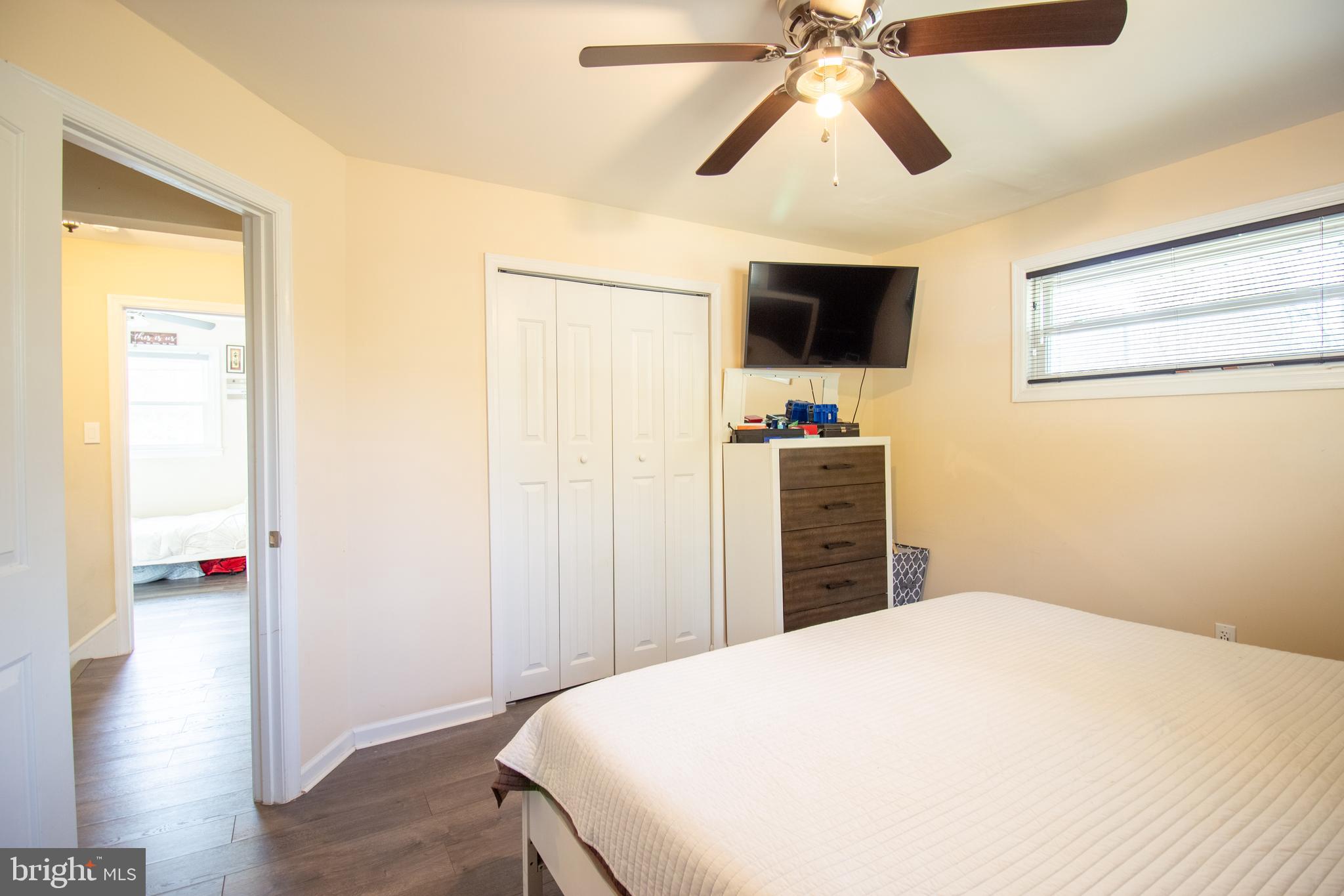 18907 Barnette Circle Triangle, VA 22172 - Photo 15 of 39 a bedroom with a bed and a flat screen tv