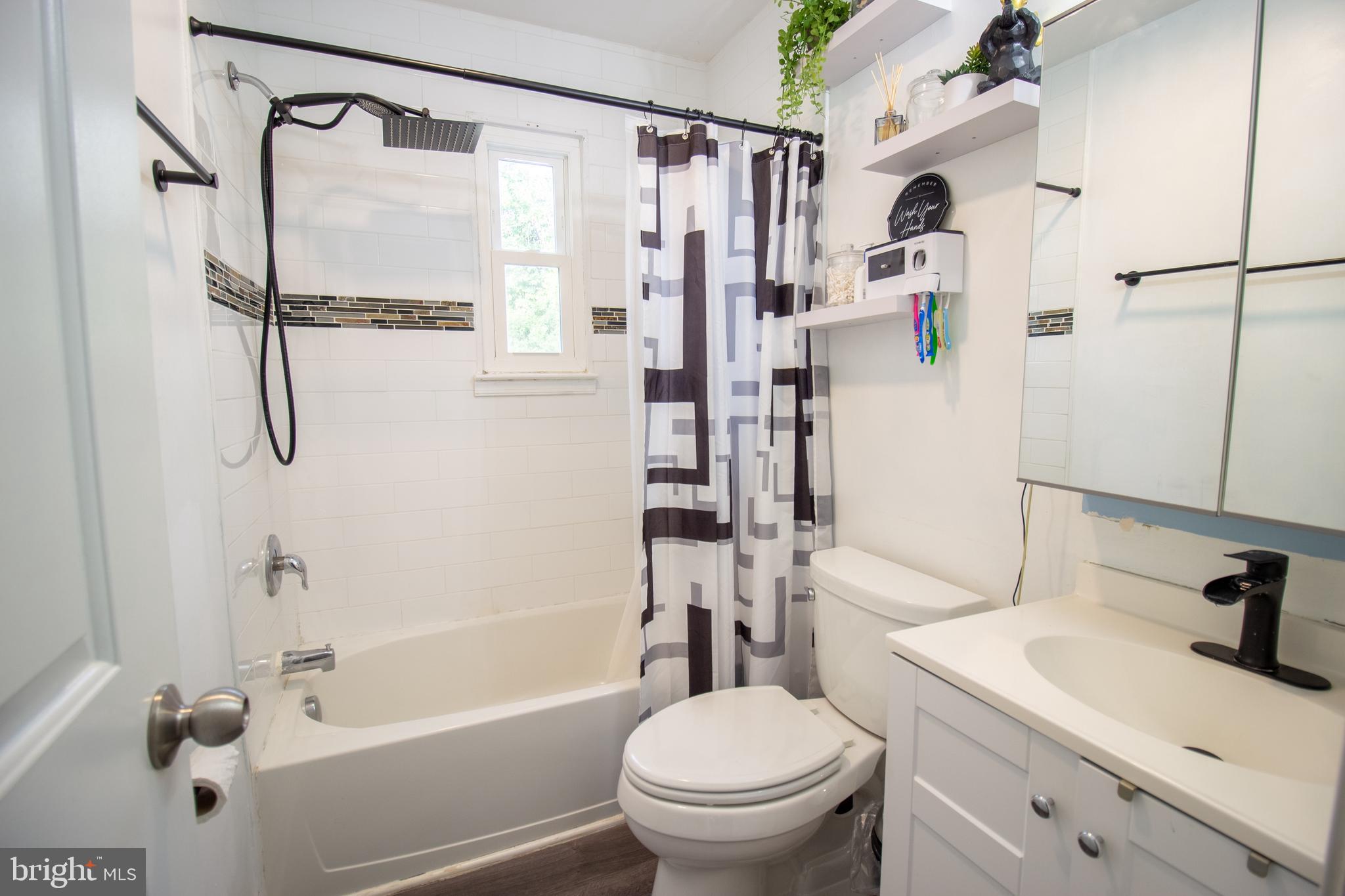 18907 Barnette Circle Triangle, VA 22172 - Photo 17 of 39 a bathroom with a sink toilet and shower