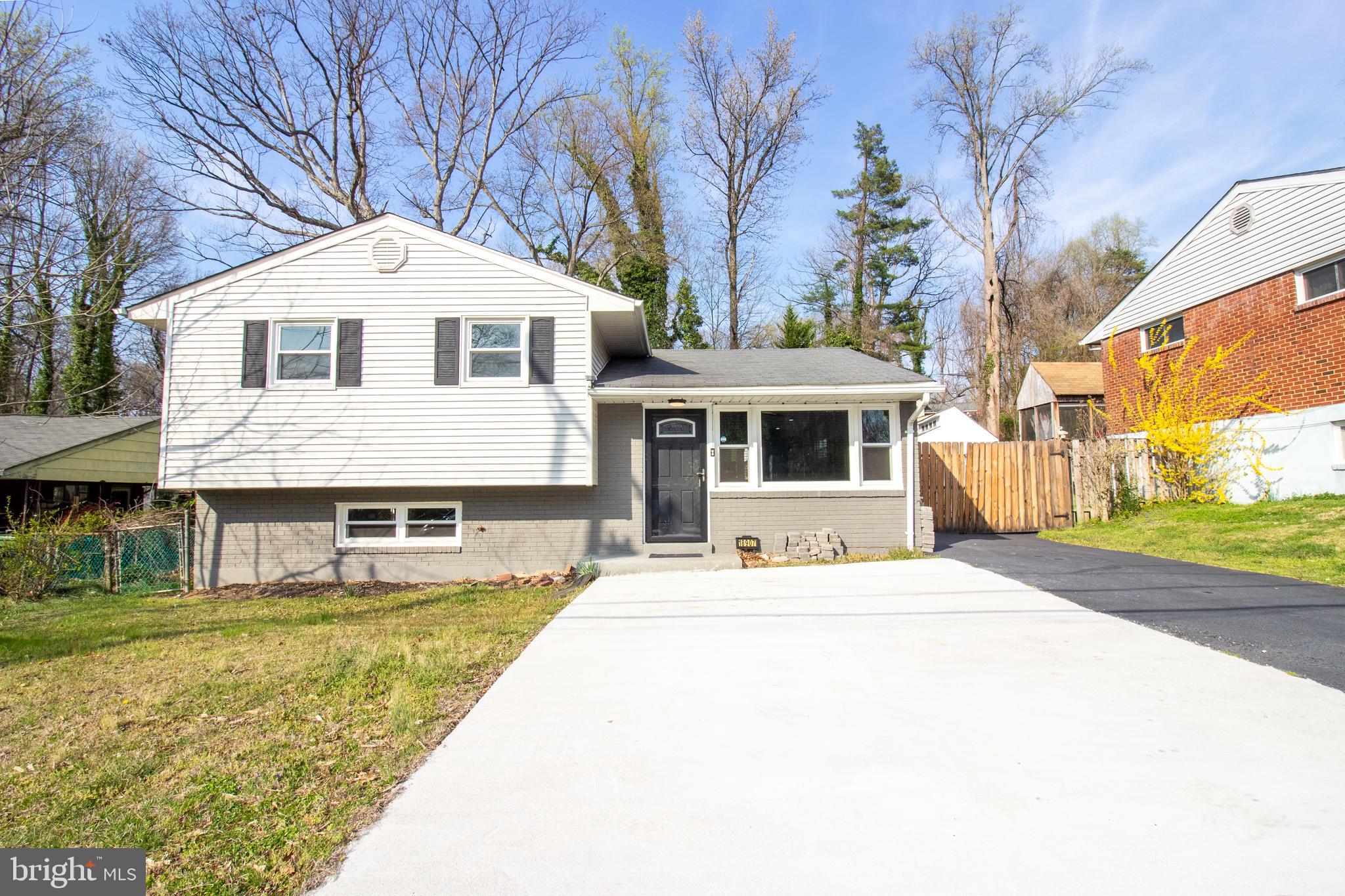 18907 Barnette Circle Triangle, VA 22172 - Photo 2 of 39 a front view of a house with a yard