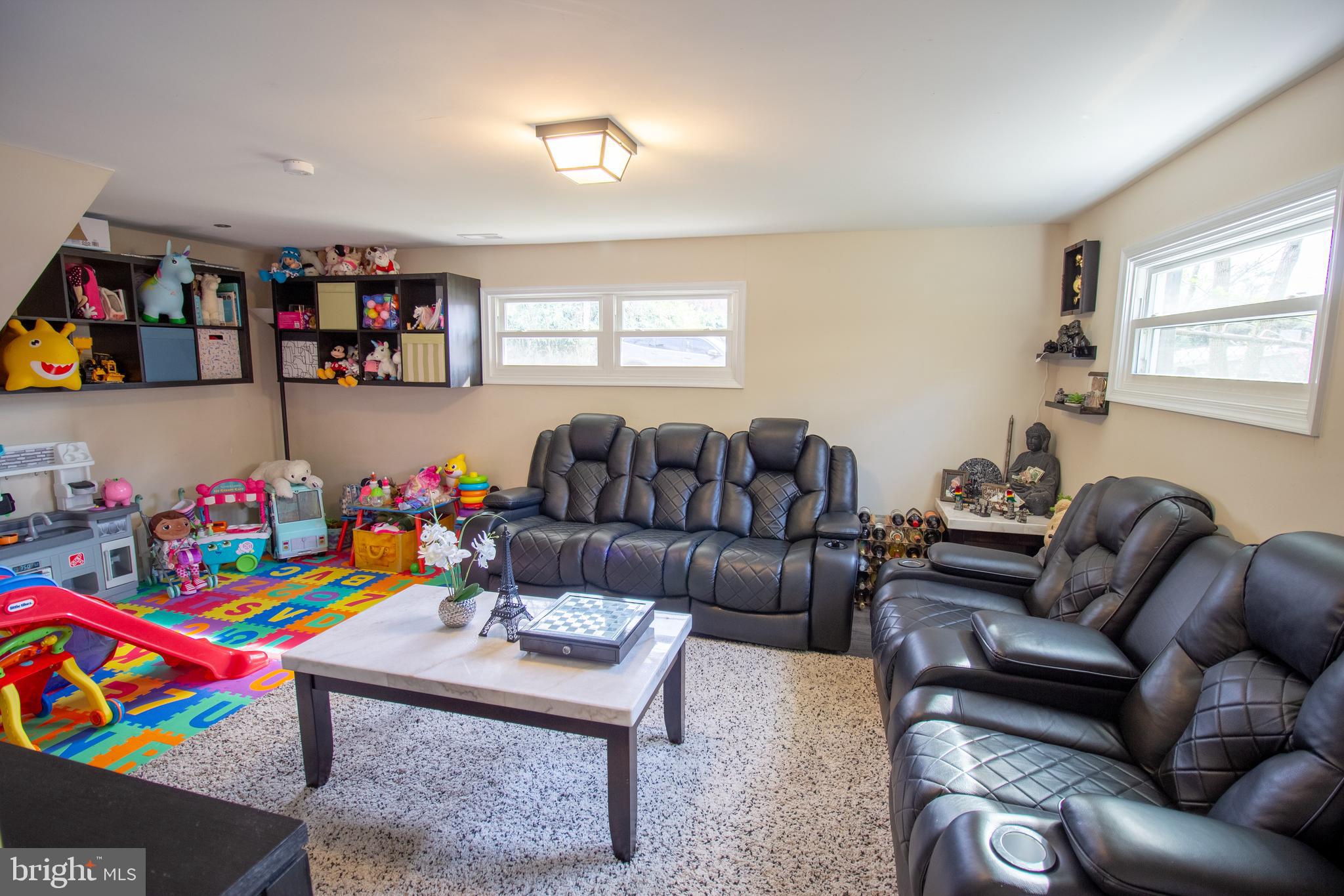 18907 Barnette Circle Triangle, VA 22172 - Photo 24 of 39 a living room with lots of furniture and a couch
