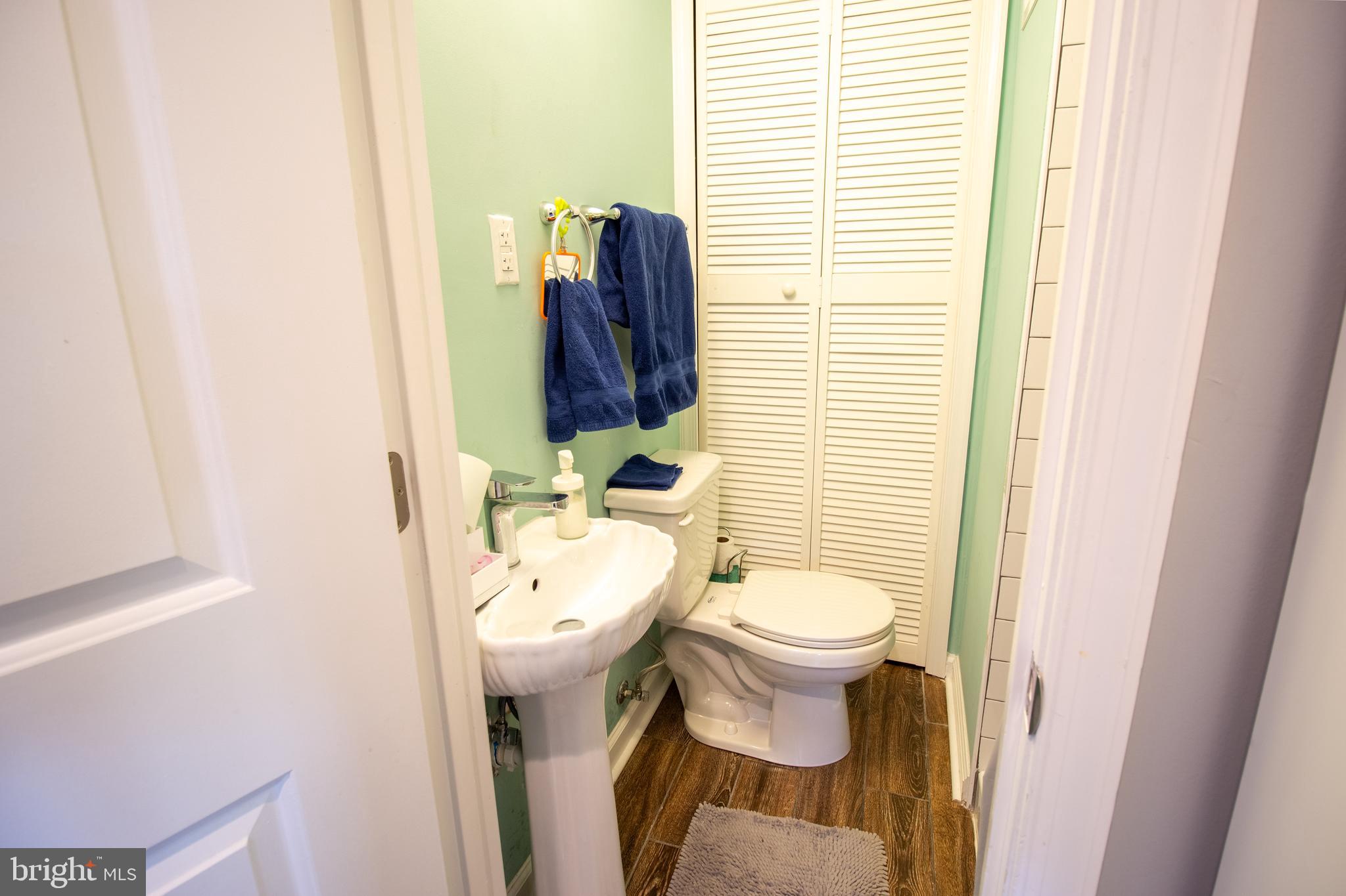 18907 Barnette Circle Triangle, VA 22172 - Photo 28 of 39 a bathroom with a toilet sink and mirror