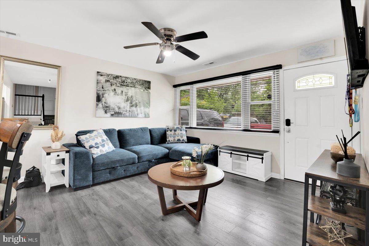 18907 Barnette Circle Triangle, VA 22172 - Photo 4 of 39 a living room with furniture and a large window