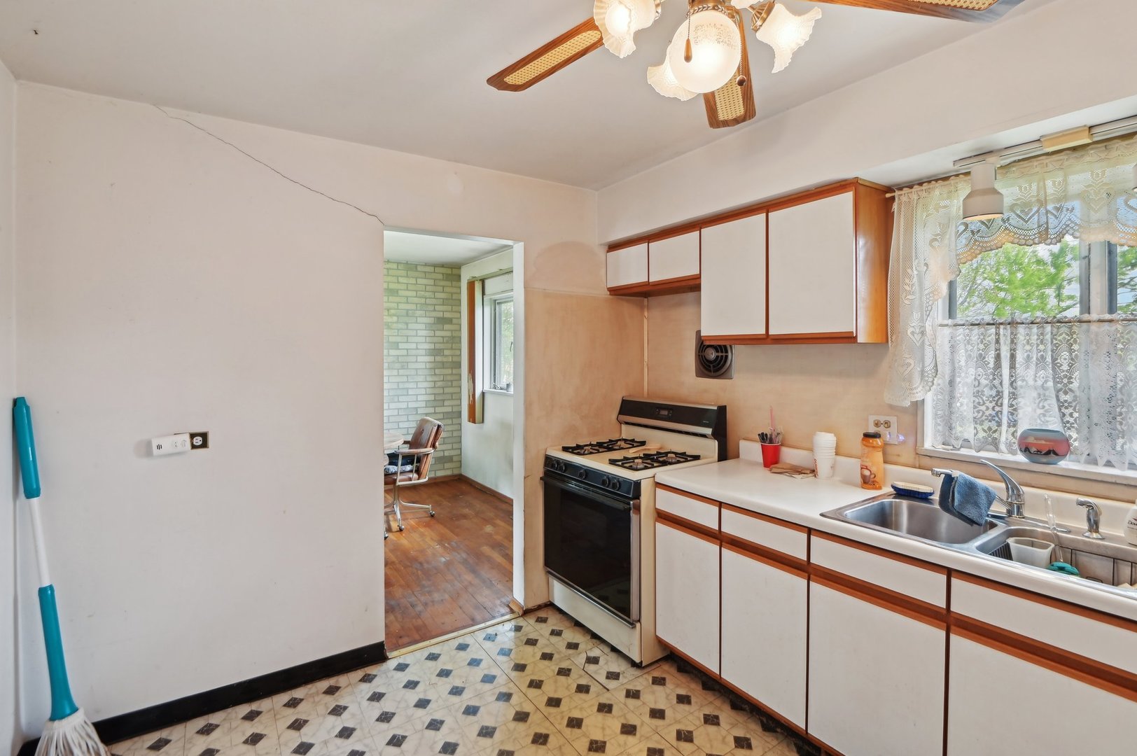 225 Bode Road Hoffman Estates, IL 60169 - Photo 11 of 26 a kitchen with stainless steel appliances a sink stove and cabinets