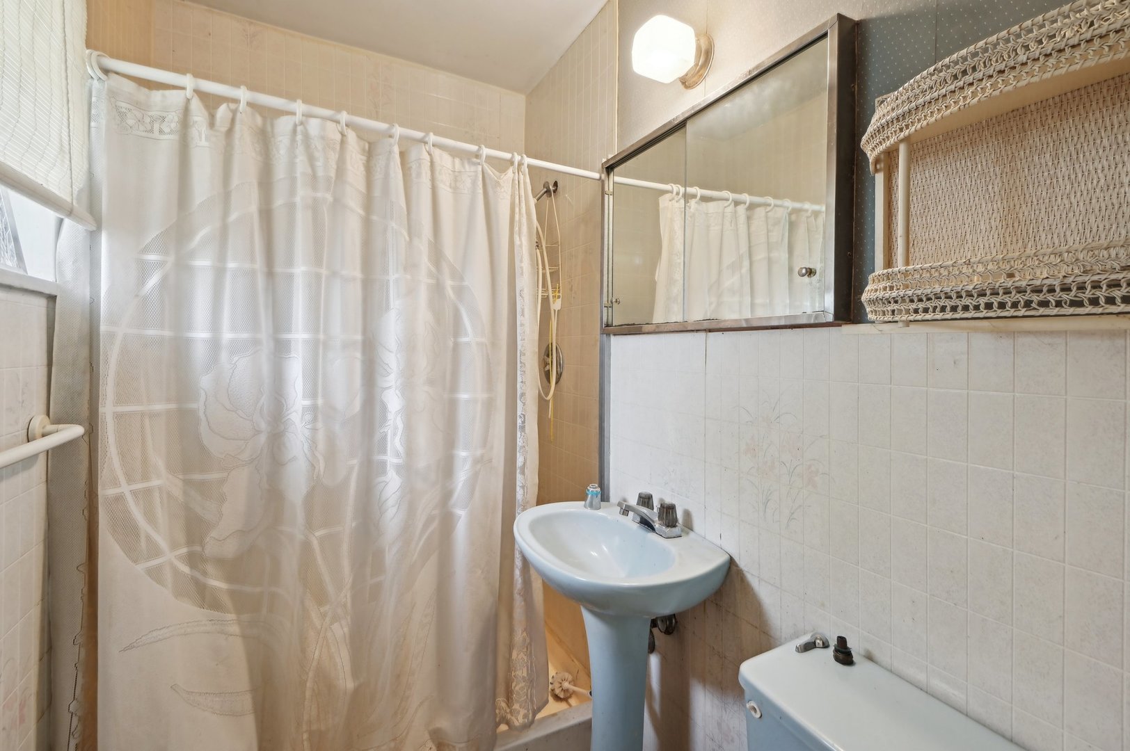225 Bode Road Hoffman Estates, IL 60169 - Photo 14 of 26 a bathroom with a sink and mirror