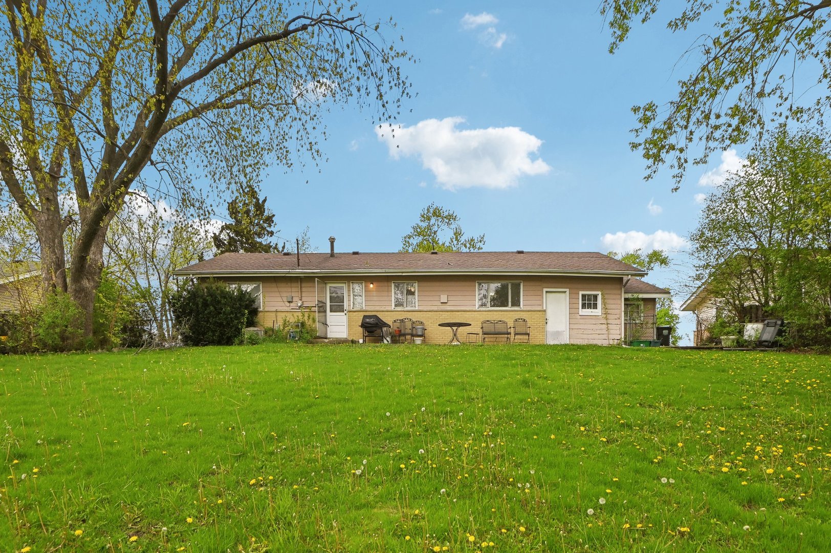 225 Bode Road Hoffman Estates, IL 60169 - Photo 22 of 26 a view of a house with a yard and sitting area