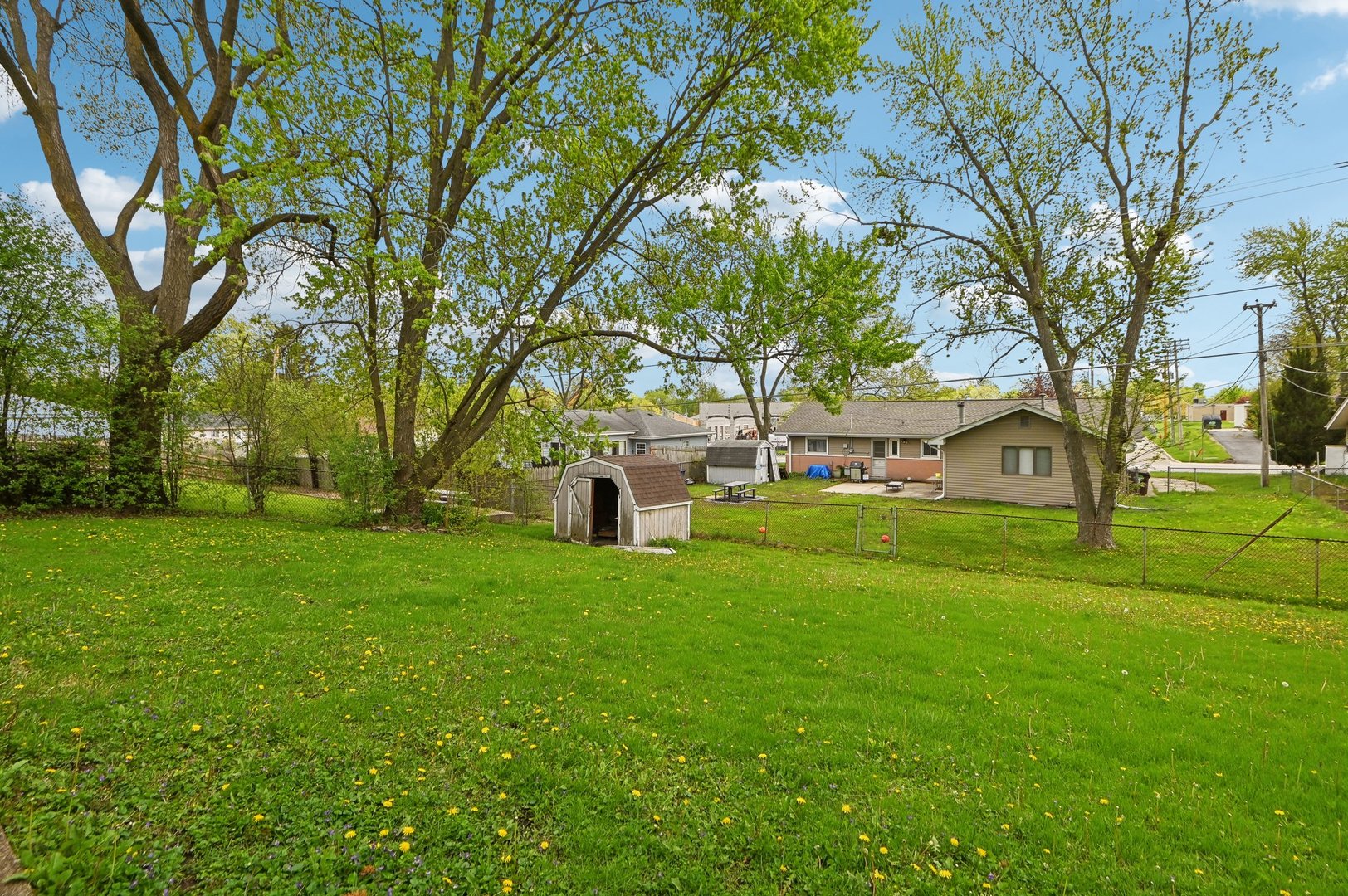 225 Bode Road Hoffman Estates, IL 60169 - Photo 24 of 26 a view of a tree in front of a white house