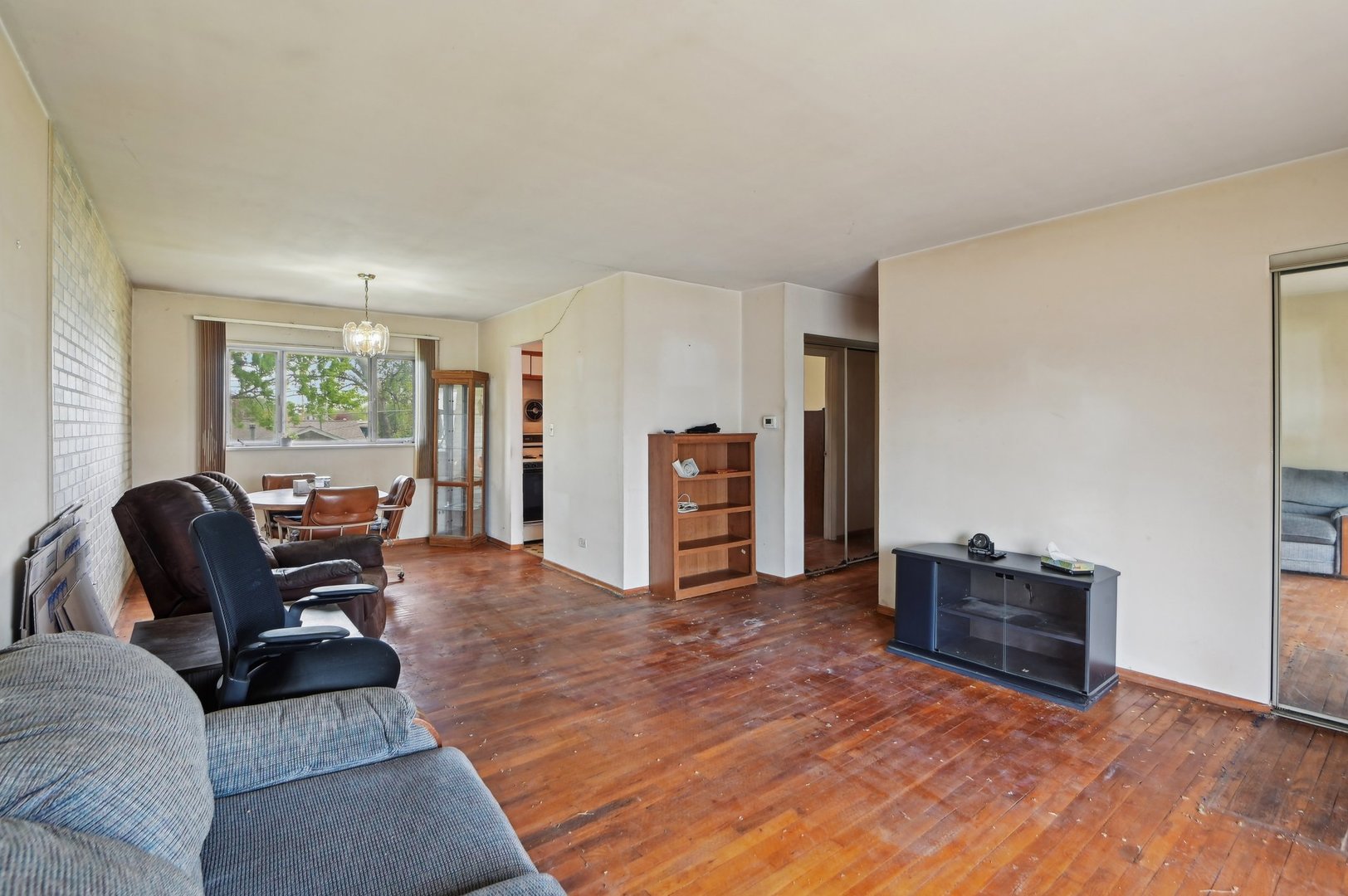 225 Bode Road Hoffman Estates, IL 60169 - Photo 5 of 26 a living room with furniture and a window
