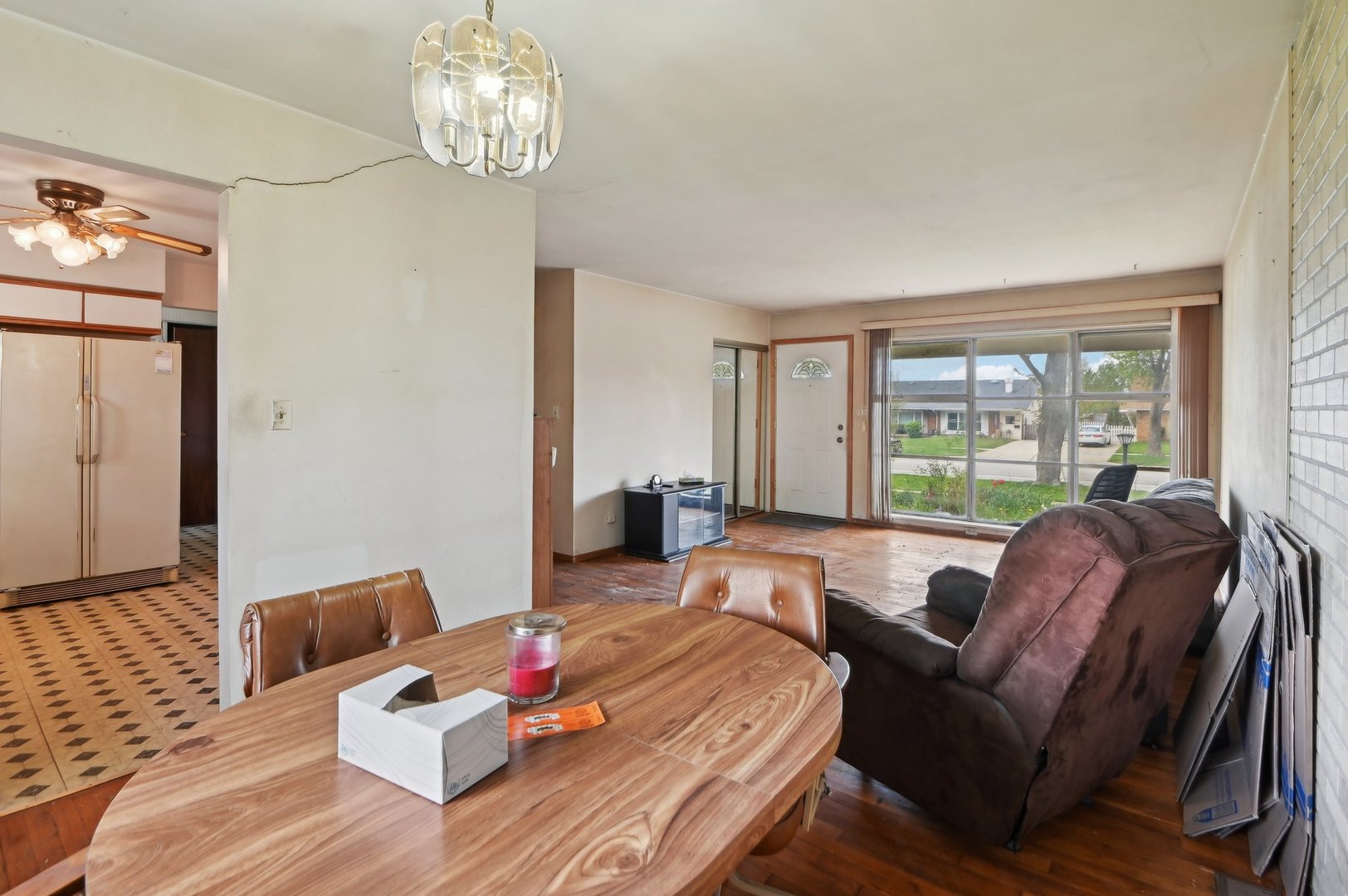 225 Bode Road Hoffman Estates, IL 60169 - Photo 7 of 26 a living room with furniture and a large window