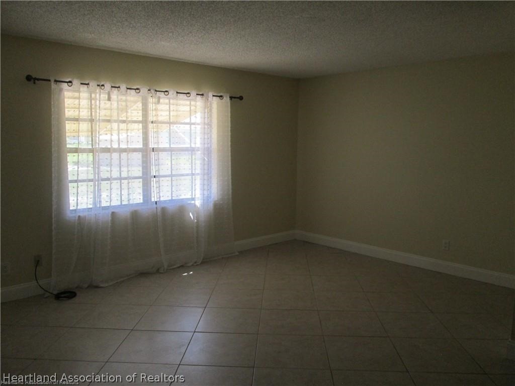 3062 Orchid Road Lake Placid, FL 33852 - Photo 11 of 11 an empty room with a empty space and windows