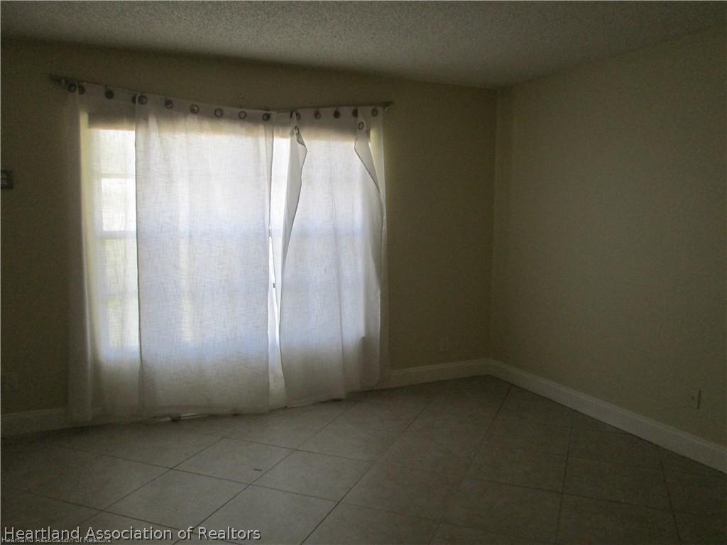 3062 Orchid Road Lake Placid, FL 33852 - Photo 7 of 11 an empty room with windows and closet