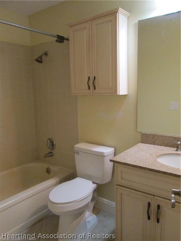 3062 Orchid Road Lake Placid, FL 33852 - Photo 9 of 11 a bathroom with a sink a toilet and shower