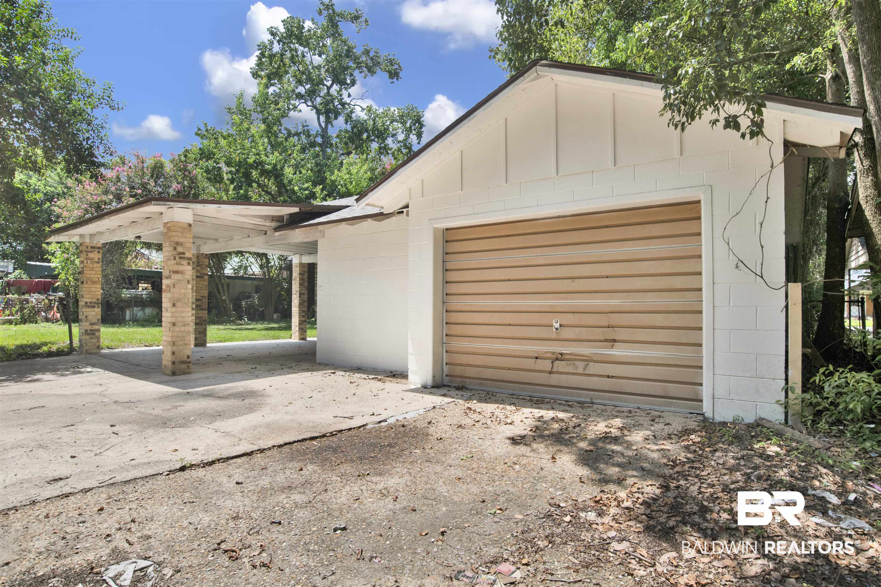 317 Lee Street Chickasaw, AL 36611 - Photo 37 of 40 Garage with concrete driveway
